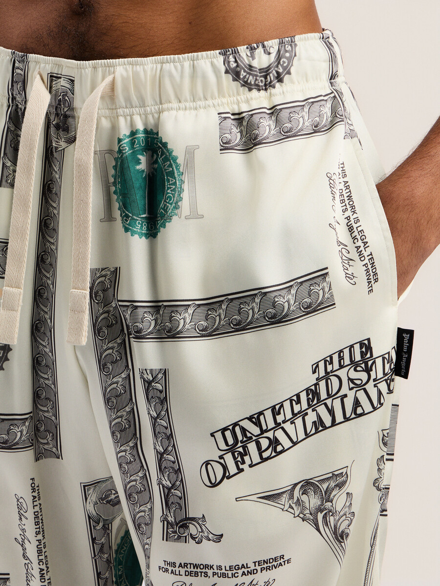 pantalon large à imprimé dollar